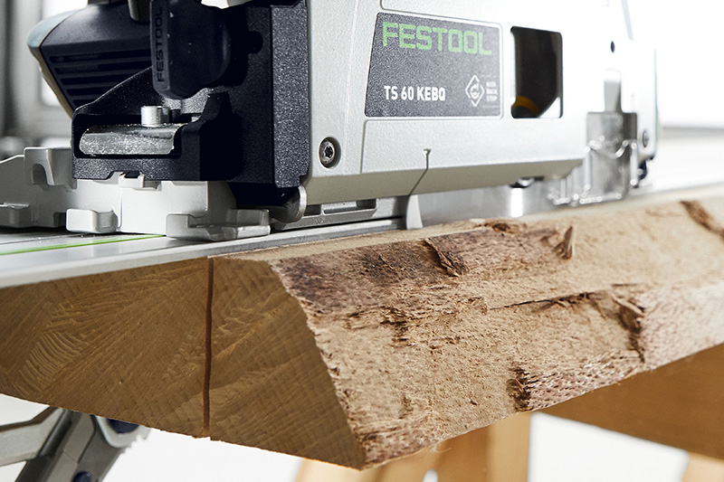 Close-up of a Festool circular saw cutting through wood