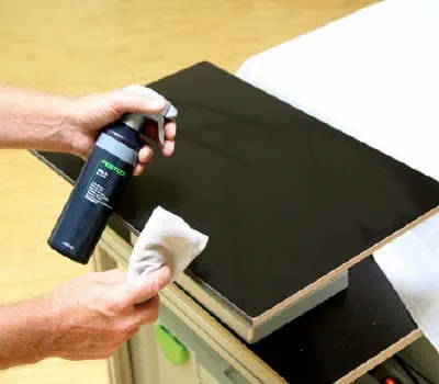 Spray the abrasive paper and surface with the finish cleaner.