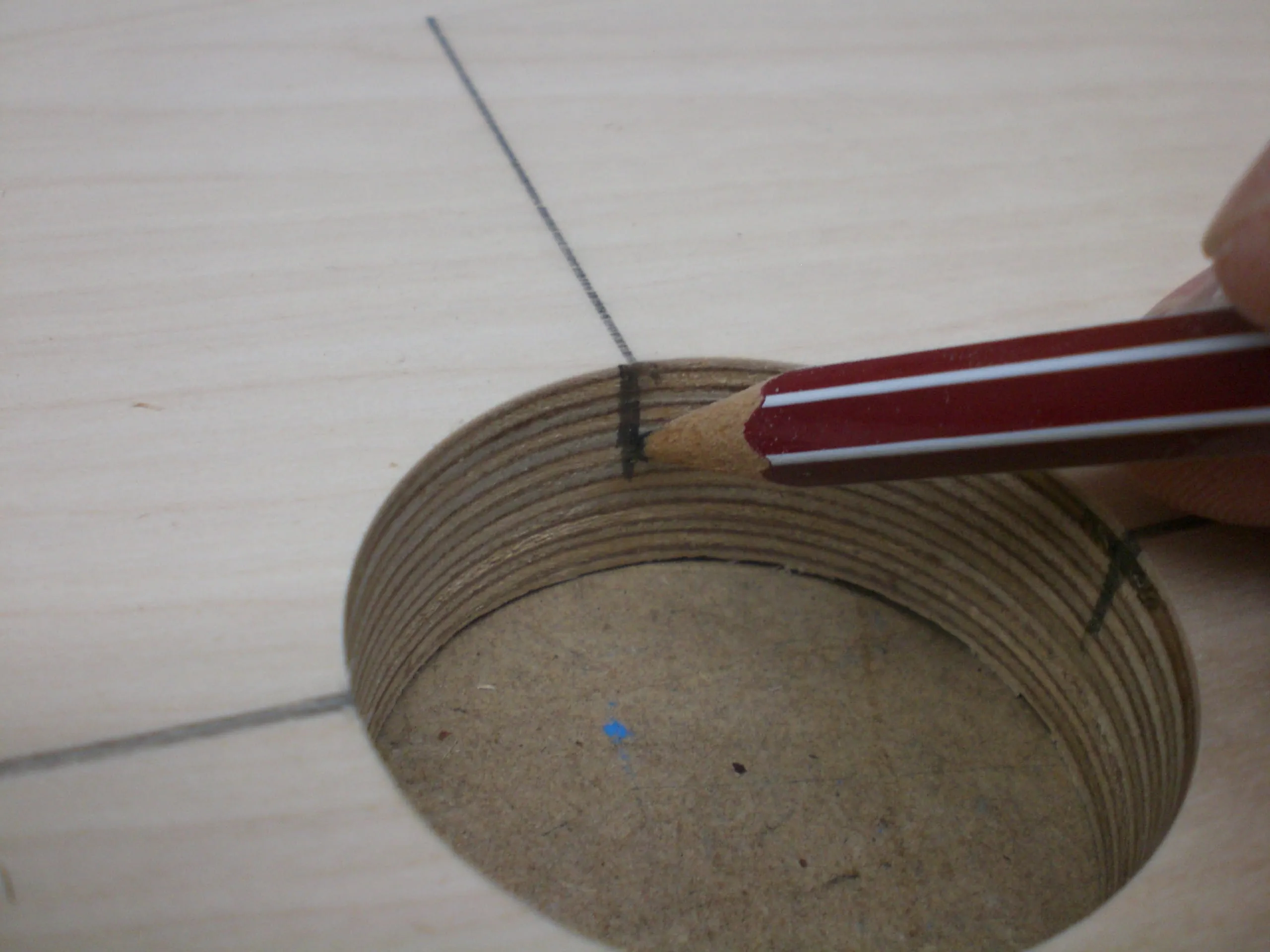 Transferring the mark onto the inner surface of the hole