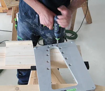 Positioning the template for routing the mortise on the beam