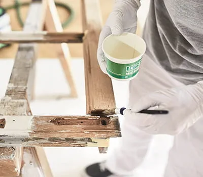 Apply DRY FIX UNI adhesive to the damaged area with a brush.